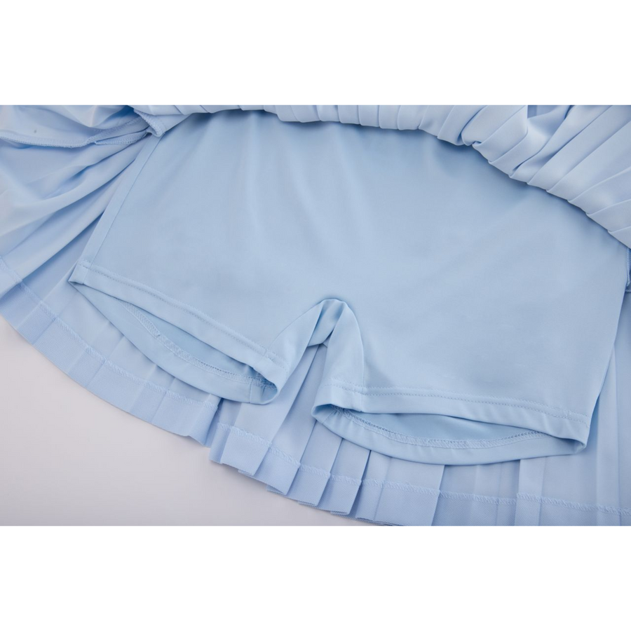PERFORMANCE PLEATED SKIRT