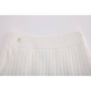 PERFORMANCE PLEATED SKIRT