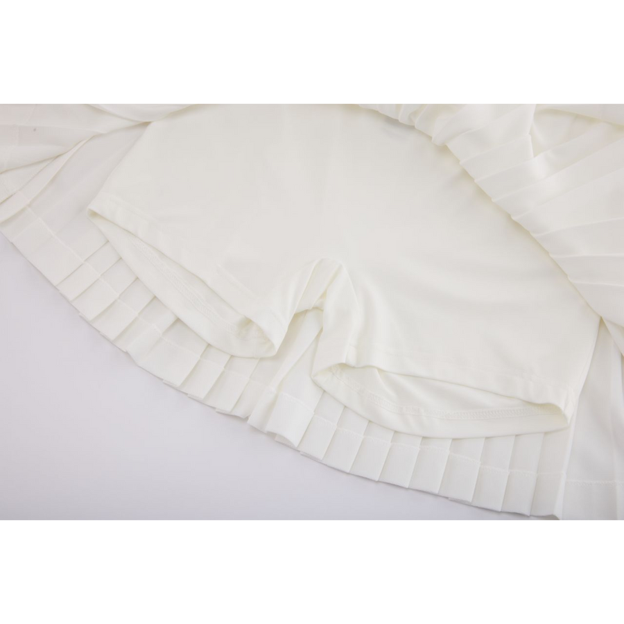 PERFORMANCE PLEATED SKIRT