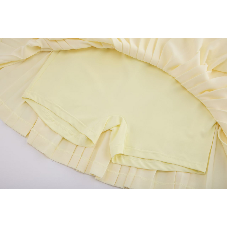 PERFORMANCE PLEATED SKIRT
