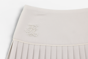 PEARL LOGO FLARED PLEATS SKIRT