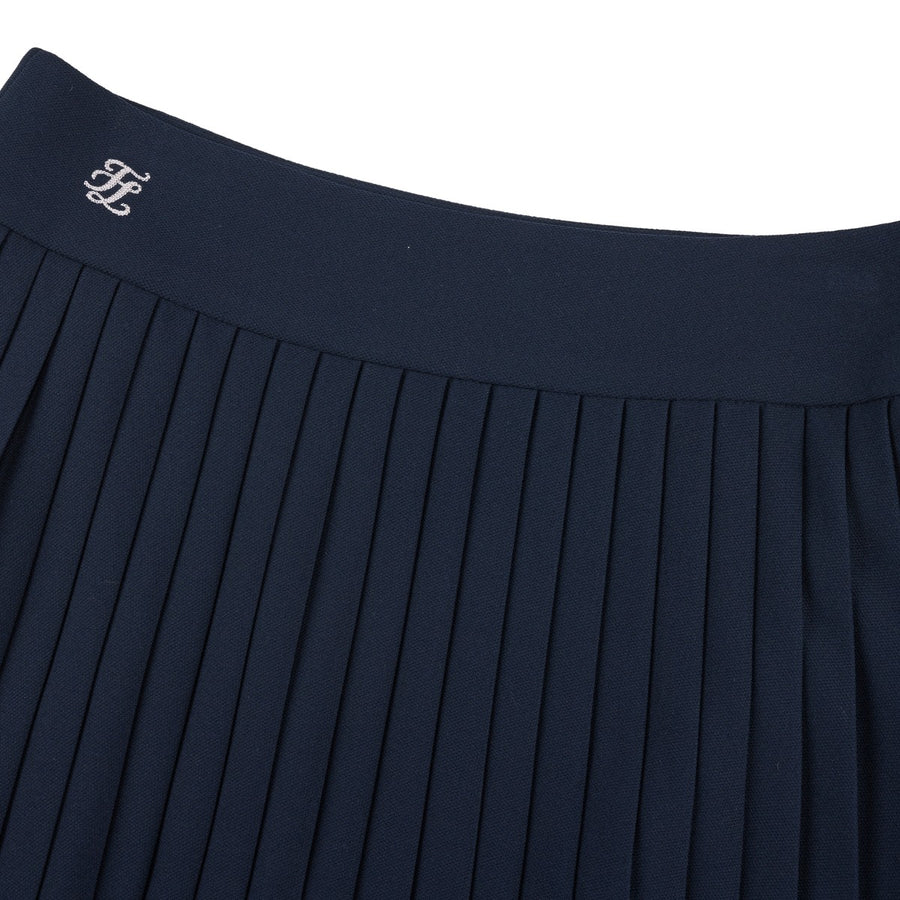 PIQUE BACK LOGO PLEATED SKIRT
